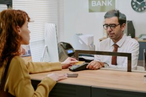 A customer engages with a bank teller through a service counter, illustrating the importance of secure and uninterrupted connectivity in financial institutions. POYNTING’s antenna solutions support dependable communication for efficient banking operations and enhanced customer service. Images are used for visual representation purposes only. These images may not be downloaded, copied, or used in any form without prior permission.